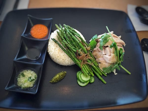 Hainanese Chicken Rice: Why the Singapore Version Outgrew Its Hainan Origin, and What You're Actually Tasting in 2026